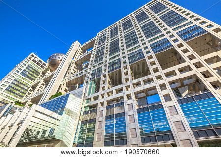 Tokyo, Japan - April 19, 2017: bottom view of Fuji Television Building and Observatory in Odaiba island, Minato district. Fuji TV headquarters is known for its bizarre architecture by Kenzo Tange.