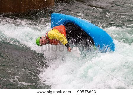 Man In Kayak About To Capsize
