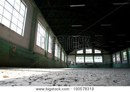 Abandoned riding hall without horses and horsemen