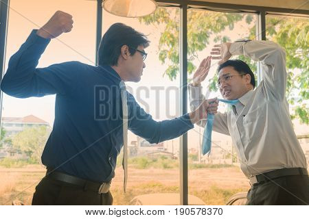 Middle-aged businessman will punch friend in anger at a coffee shop
