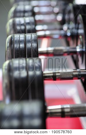 Row of spinlock dumbbels in special rack