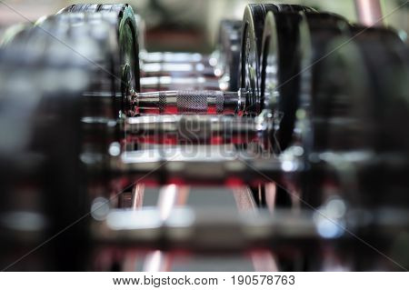 Row of spinlock dumbbels in special rack