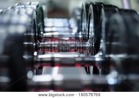 Row of spinlock dumbbels in special rack