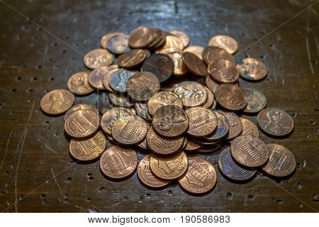 Pile of pennies laying on the table