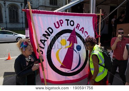 London, UK - June 10 2017: Unidentified protesters  at Westminster Palace expressing their anger at Theresa May's government and her alliance with the Democratic Unionist Party, London, UK