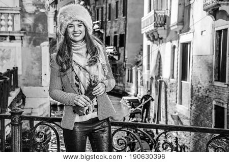 Smiling Trendy Traveller Woman In Venice, Italy In Winter