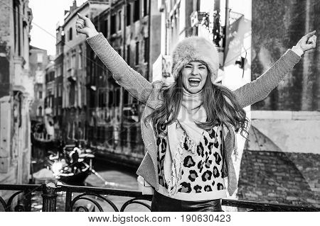 Smiling Traveller Woman In Venice, Italy In Winter Rejoicing