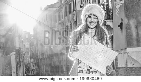Happy Young Woman In Venice, Italy In Winter With Map