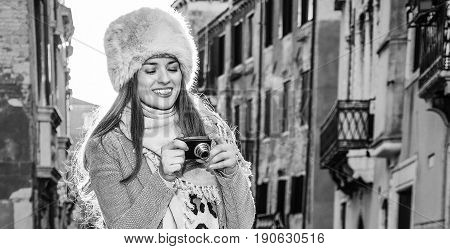 Traveller Woman In Venice, Italy In Winter Viewing Photos