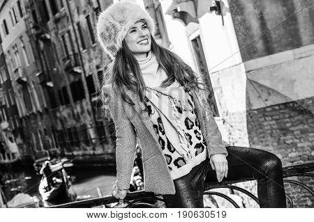 Smiling Woman In Venice, Italy In Winter Looking Into Distance