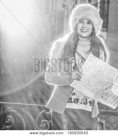 Smiling Tourist Woman In Venice, Italy In Winter With Map