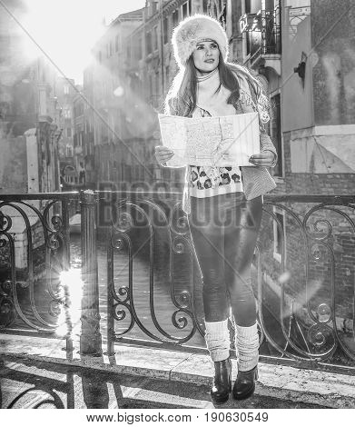 Elegant Tourist Woman In Venice, Italy In Winter With Map