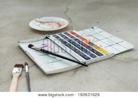 Watercolor aquarelle paints in box with palette.