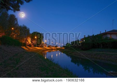 Rovigo, Italy, June, 9, 2017: night landscape with the image of channel in Rovigo, Italy