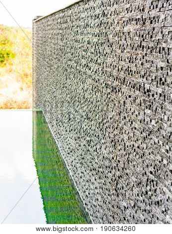 Dark grey stone tile dbrick wall backgrounf