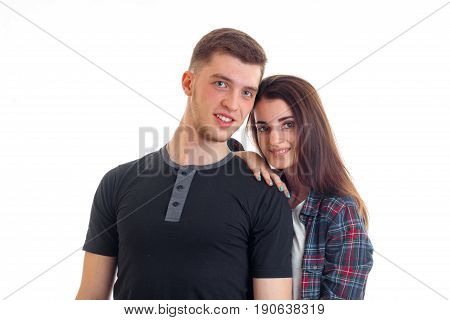 cute young couple smiling at camera isolated on white background