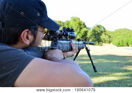 engaging gun rifle  sniper huntingmen landscape trees forest shooting men
