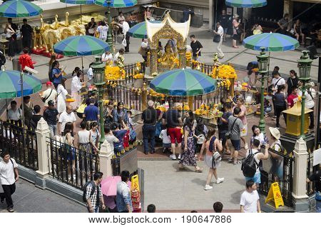View Of The Hindu Shrine From Bts Skytrain And Thai And Foriener People Praying Thao Maha Phrom Or L