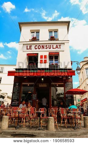 PARIS , France- June 01, 2017: View of typical paris cafe in Paris. Montmartre area is among most popular destinations in Paris, Le Consulat is a typical cafe.