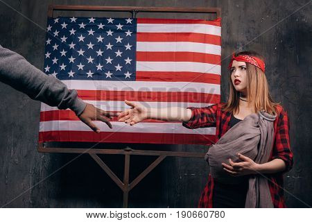 Single american mother. Break of family relations. Sad wife and husband on USA national flag background. Divorce, social problem, father leaving, youth pregnancy concept