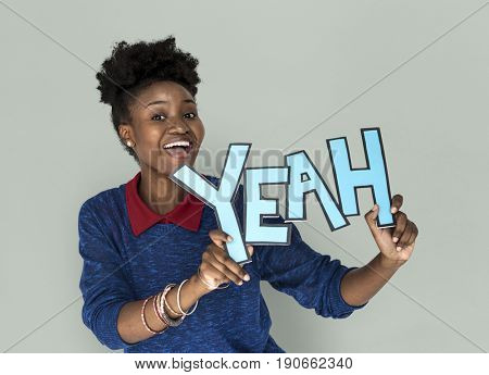 Smiling African Woman Holding Yeah Word