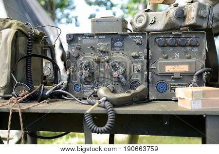 WROCLAW POLAND - JUNE 3: Reconstruction groups rally. Militarians fan gathering people in uniforms historical vehicles and weapons. Vintage radio station from Vietnam War on June 3rd 2017 in Wroclaw.