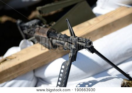 WROCLAW POLAND - JUNE 3: Reconstruction groups rally. Militarians fan gathering people in uniforms historical vehicles and weapons. Old machine gun from World War II on June 3rd 2017 in Wroclaw.