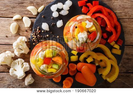 Giardiniera - Vrelish Of Pickled Vegetables In Vinegar Closeup. Horizontal Top View