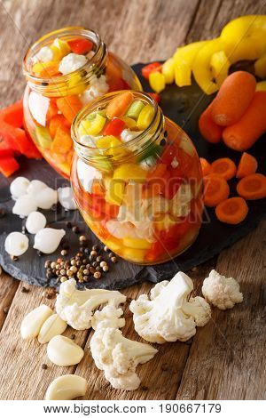 Giardiniera Salad From Pickled Cauliflower, Pepper And Carrots Close-up In Glass Jars