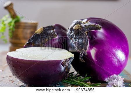 Violet eggplant fresh healthy vegetables on wooden plank