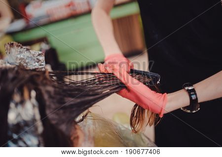 Woman In Gloves Is Dying Hair