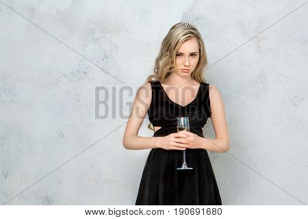 Young female party celeration isolated on white background sad