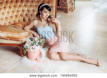 Photo of beautiful young woman with makeup in fashion clothes