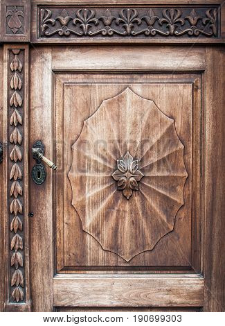 Old wooden door with iron handle on the Prešeren square in Ljubljana, Slovenia - Jun 2017