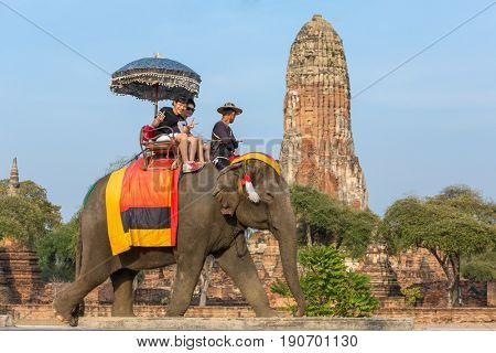 Ayutthaya, Thailand - March 2, 2017: Tourists on the elephants ride tour of the ancient city in Ayutthaya, Thailand