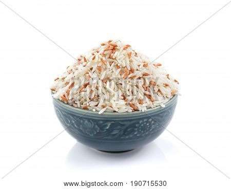 rice in ceramic bowl on white background