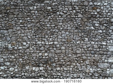Gray dark wall of an old castle.
