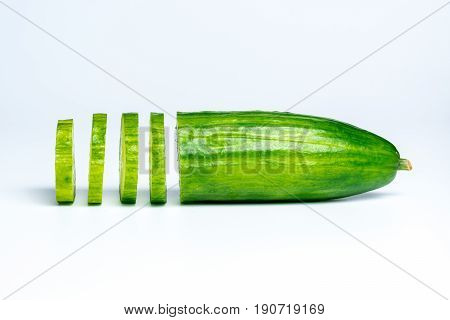 Cucumber slices from the side on white background