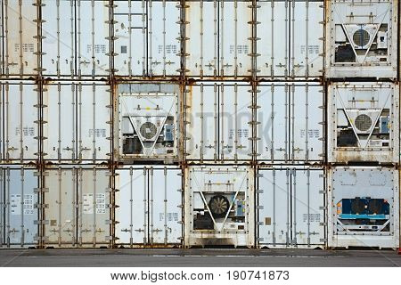 Stacked containers in a shipping terminal