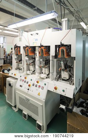 MOSCOW, RUSSIA - FEBRUARY 21, 2017: Moscow shoe factory JSC RALF RINGER. The machine for shaping the back of the shoes.