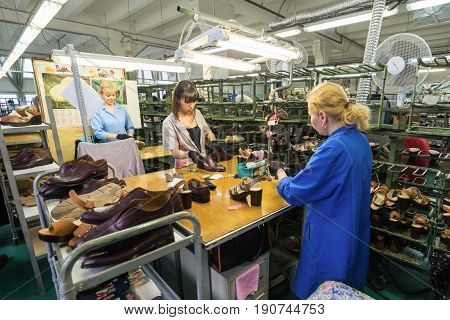 MOSCOW, RUSSIA - FEBRUARY 21, 2017: Moscow shoe factory JSC RALF RINGER. Female workers make shoes at a shoe factory.