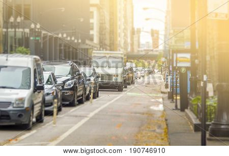 Lots of cars standing in the queue at roadway with the bike lane free