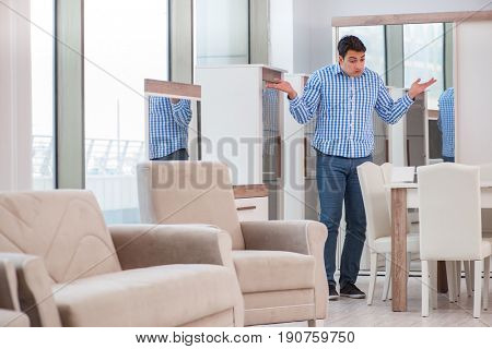 Young man shopping in furniture store