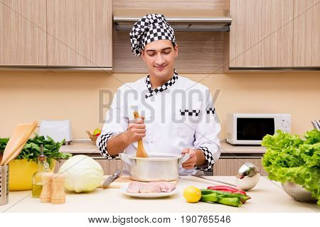 Young chef working in the kitchen
