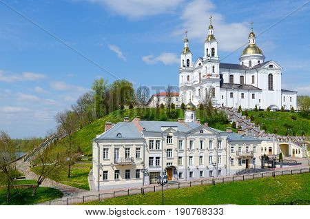 Beautiful spring view of Holy Dormition Cathedral on Assumption Mount and Holy Spirit Monastery at river Western Dvina Vitebsk Belarus