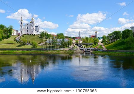 Beautiful view of historical center of Vitebsk over Western Dvina Belarus. Holy Dormition Cathedral Holy Spirit Monastery Resurrection Church and Town Hall