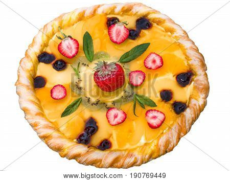 Fruit pizza with strawberries cherries cream jelly pineapple kiwi and mint leaves home-made.Isolated on white background closeup