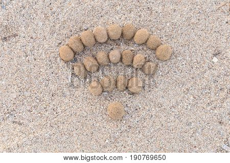 Wifi Sign Created With Dried Algae Ball On Sand Beach