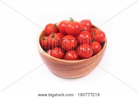 Fresh tomatoes  in a basket with clipping path on white background.