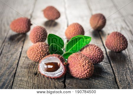 Lychees exotic fruits on a wooden background
